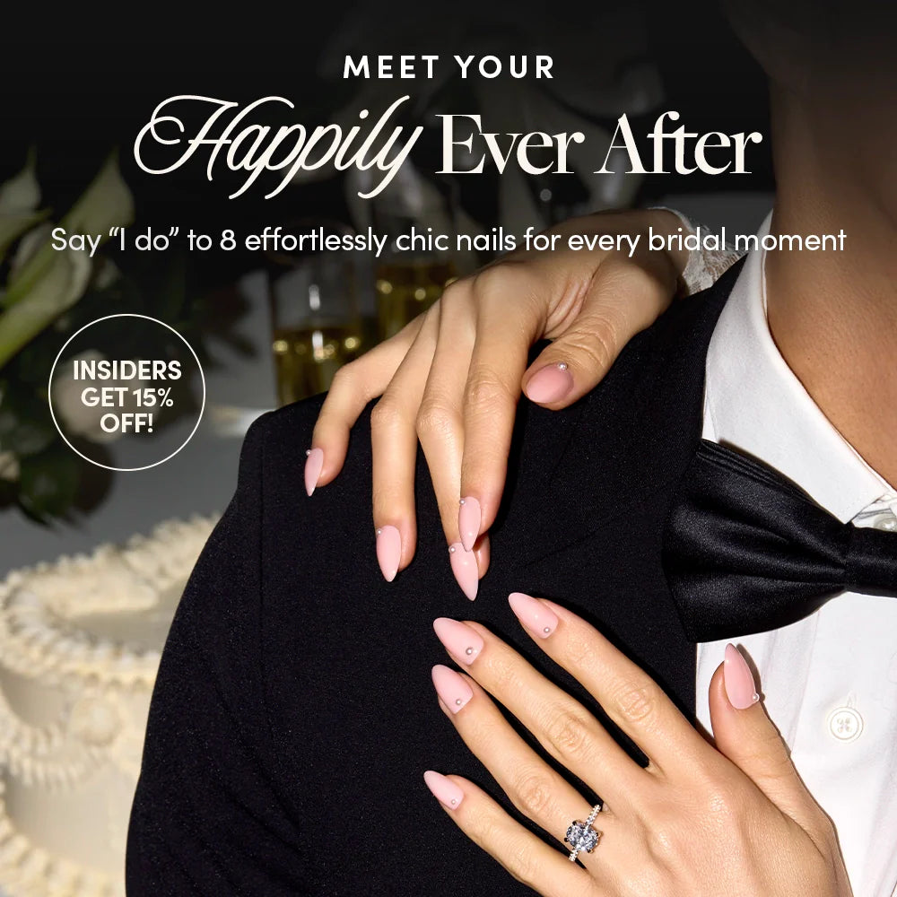 Close-up of a bride’s hands with long, pale pink nails resting on a groom in a tuxedo. Text promotes chic bridal nails and a 15% discount for insiders. A wedding cake and drinks are blurred in the background.
