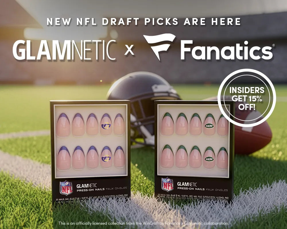 Two people sit on grass, showing off manicured nails with Glamnetic press-on nail sets next to a football. Text reads, “TOUCHDOWN TIPS GLAMNETIC x Fanatics” and “INSIDERS GET 15% OFF!”.