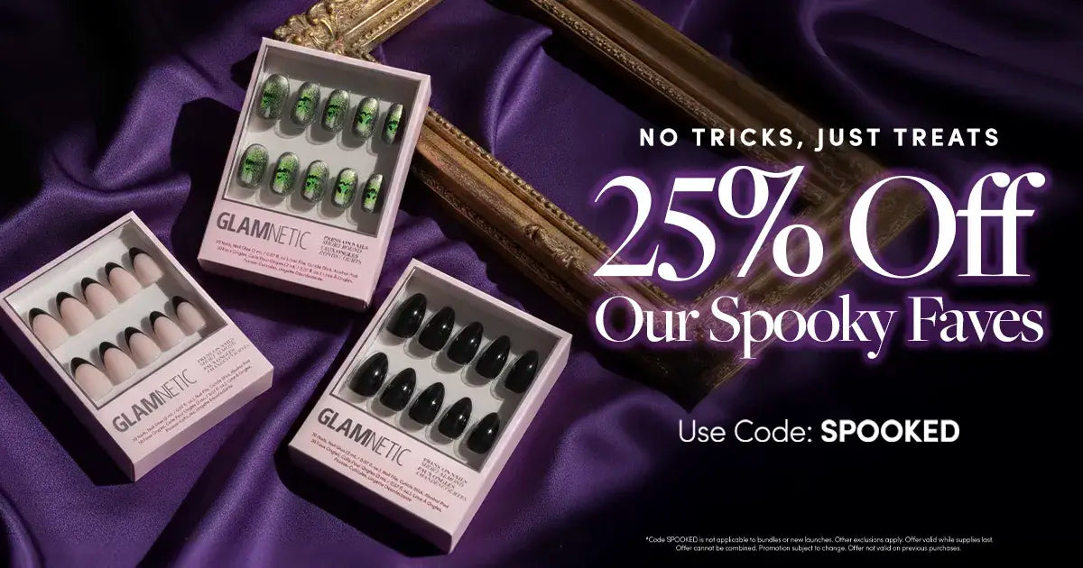 Three boxes of Glamnetic Halloween-themed press-on nails displayed on purple fabric with a gold frame. Text reads: 25% Off Our Spooky Faves. Use Code: SPOOKED. No Tricks, Just Treats.