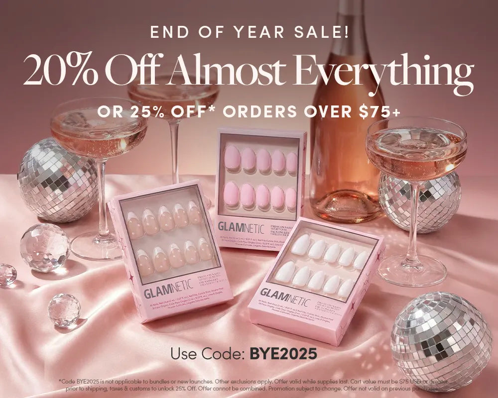 Pink-themed sale display with fake nails, disco balls, two pink drinks, and boxes labeled Glamnetic. Text advertises 20% Off Almost Everything and a discount code BYE2025.