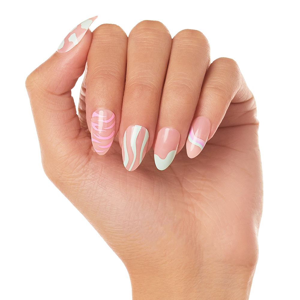 A hand shows off Wild Card press-on nails by glamnetic, featuring long almond shapes in pastel pink and mint green with swirls, waves, a heart, and marbled art for a chic, creative style. - Product image