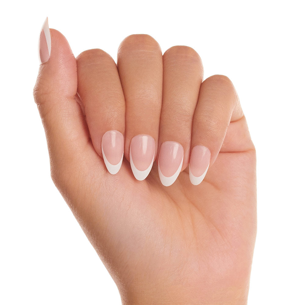 A hand with glamnetic Ma Damn nails, featuring neatly manicured, cruelty-free almond shapes and a modern French tip design—pale pink bases with crisp white curved tips. - Product image