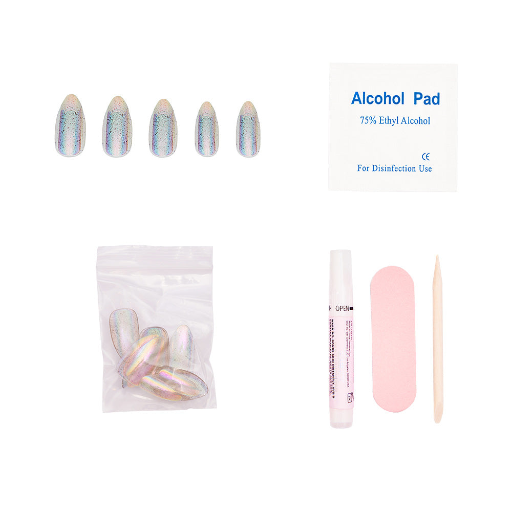 The glamnetic Stardust set includes holographic almond-shaped press-on nails, an alcohol pad, extra nails in a sealed bag, nail glue, a pink file, and a wooden cuticle stick—all arranged on a white background. - Product image