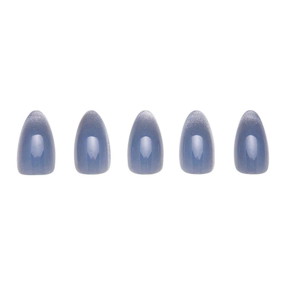 Five glamnetic Baby Blues artificial nails, each in a shiny grayish-blue pastel with a velvet metallic finish, are displayed in a row on a white background. - Product image