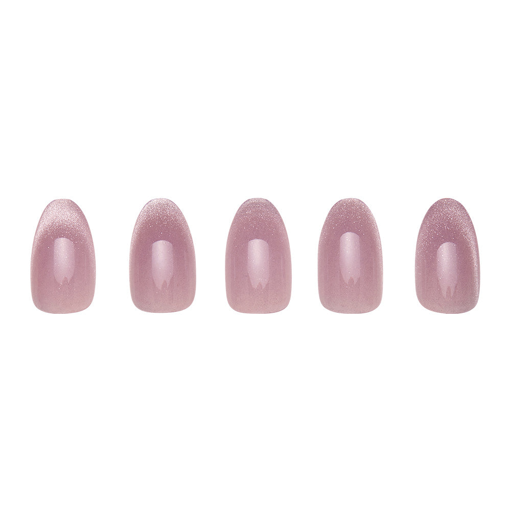 Five short oval artificial nails from the glamnetic Fairy Dust set are arranged in a row, each coated with a shiny, mauve-pink velvet metallic polish and displayed on a plain white background. - Product image
