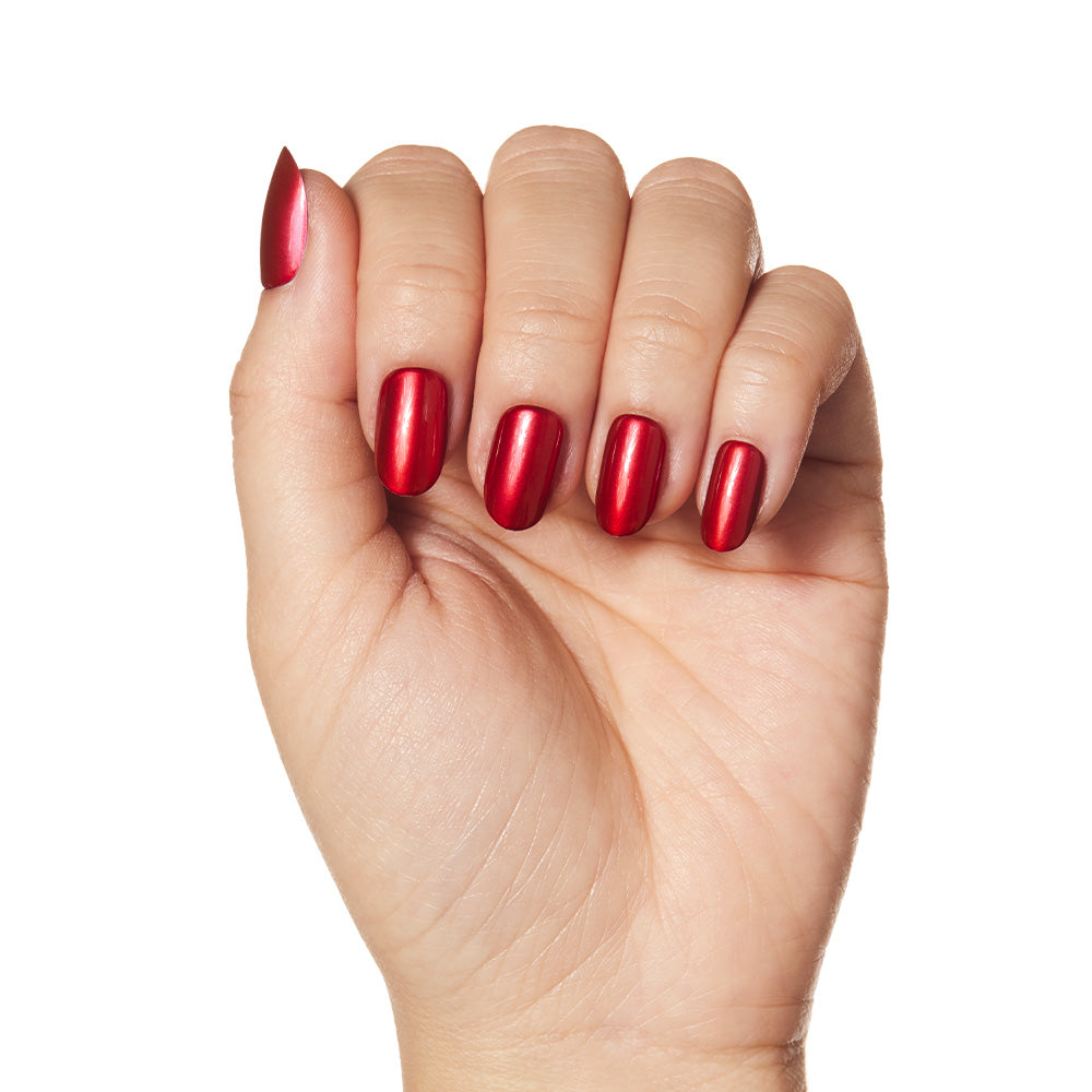 A hand with neatly manicured, short round nails painted in glamnetic’s Cherry Glaze is displayed against a plain white background. - Product image