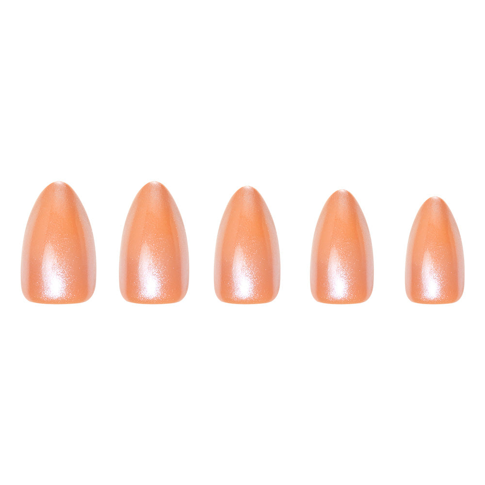 Five short almond artificial nails from glamnetic’s Maple Glaze set, each painted a glossy, shimmery peach-nude taupe, are arranged in decreasing size—perfect for achieving a trendy nude look. - Product image