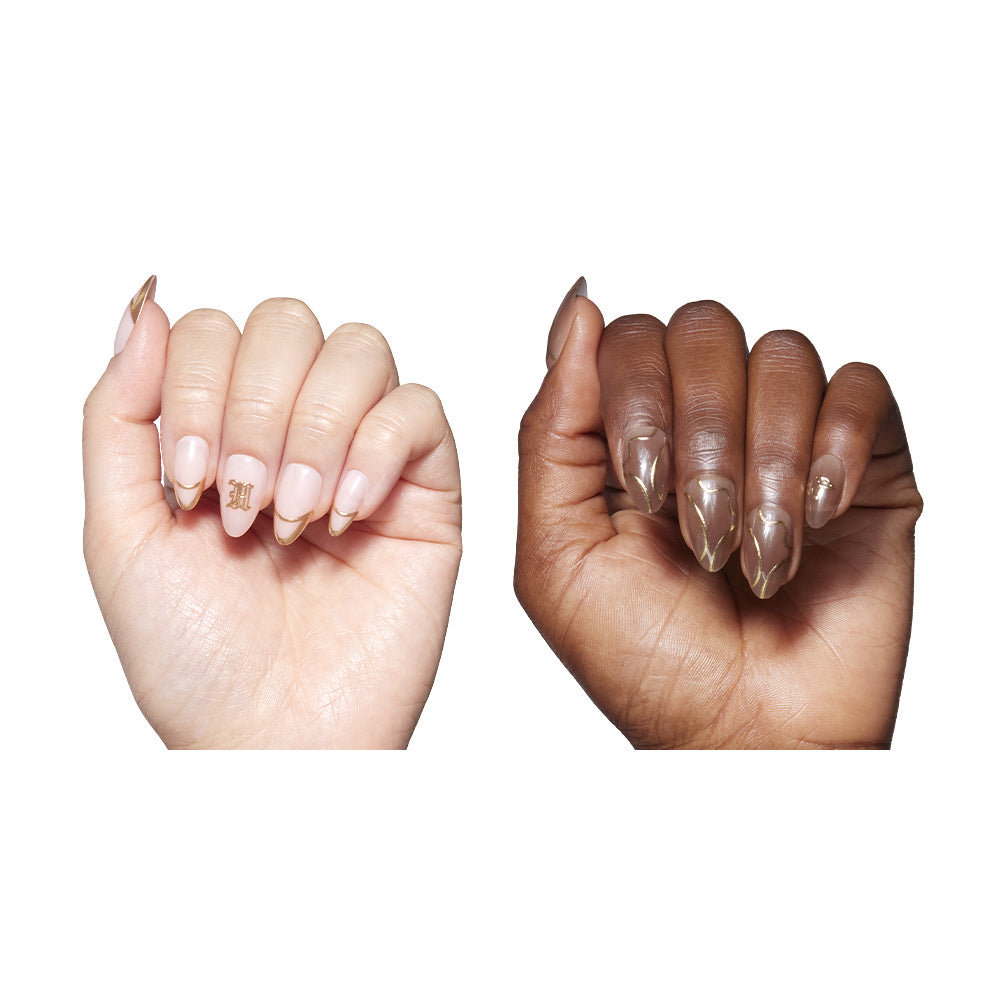 Two hands with manicured nails in Team Hufflepuff™ by glamnetic, featuring gold metallic tips; one hand is light-skinned and the other dark-skinned. The light hands ring finger has a 3D gold foil letter M. All polishes are vegan and cruelty free. - Product image