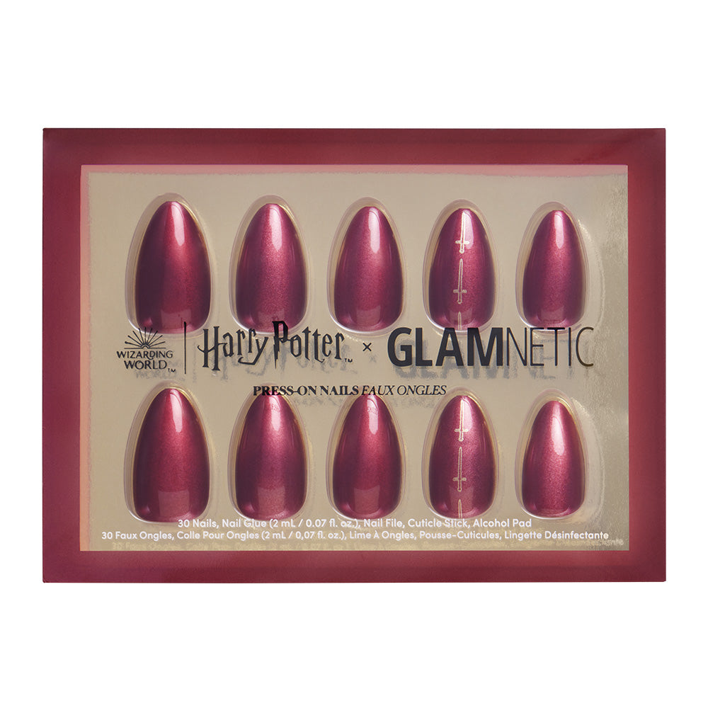 The glamnetic Gryffindor™ set features short almond press-on nails in shimmery maroon with a scarlet chrome finish, showcased on a gold background inside a red frame.