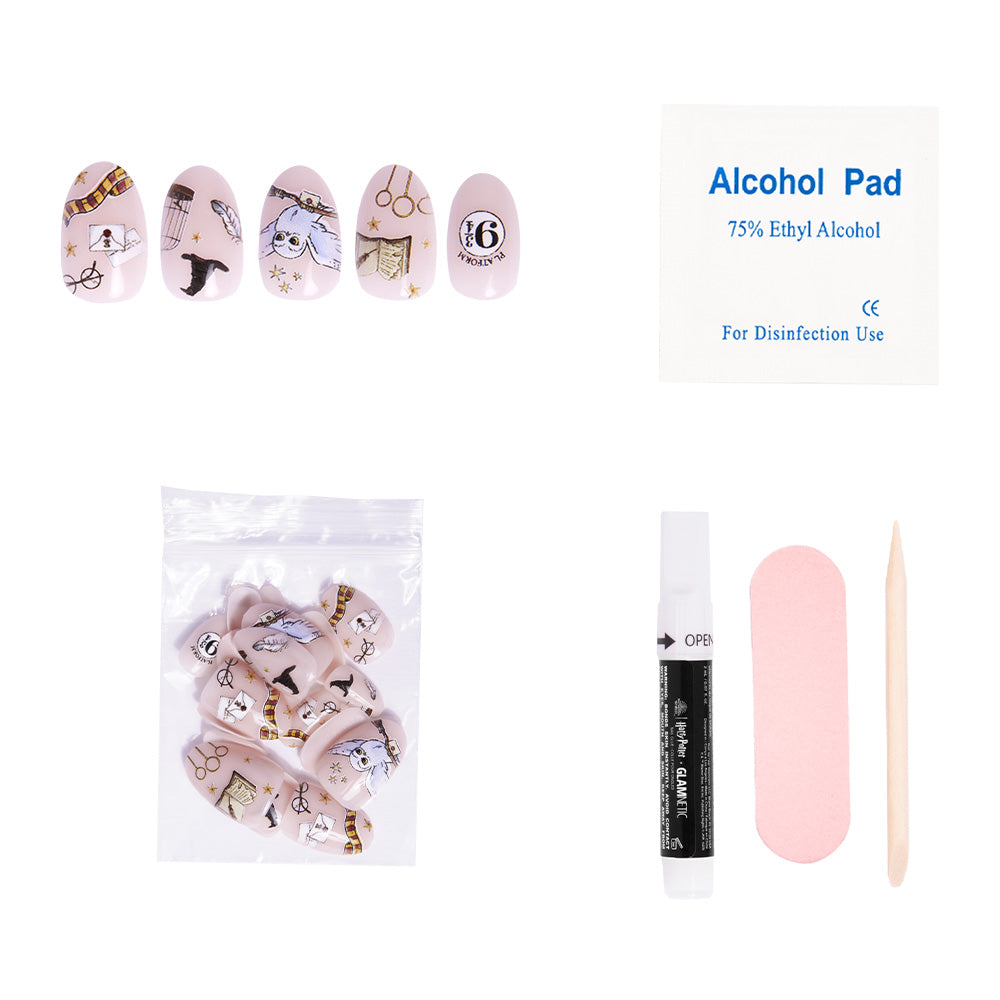 The glamnetic Hogwarts™ nail kit includes Harry Potter illustrated press-on nails, a matching packet, alcohol pad, glue, pink nail file, and wooden cuticle stick—all displayed on a white background. - Product image