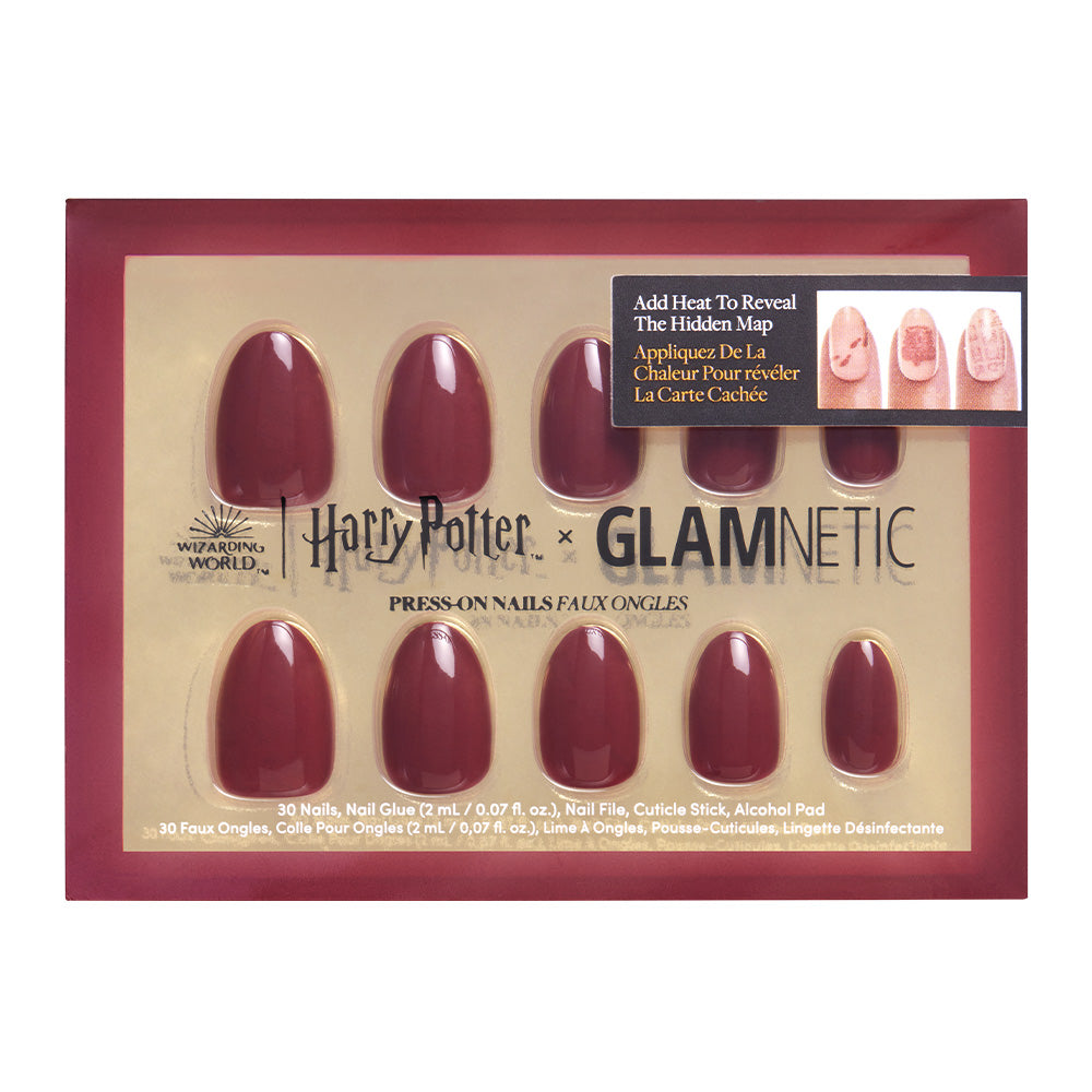 A box of glamnetic’s vegan, cruelty-free Marauders Map™ nail set in deep red, featuring 10 color-changing nails with gold packaging and included nail glue, labeled “Add Heat To Reveal The Hidden Map.”. - Product image