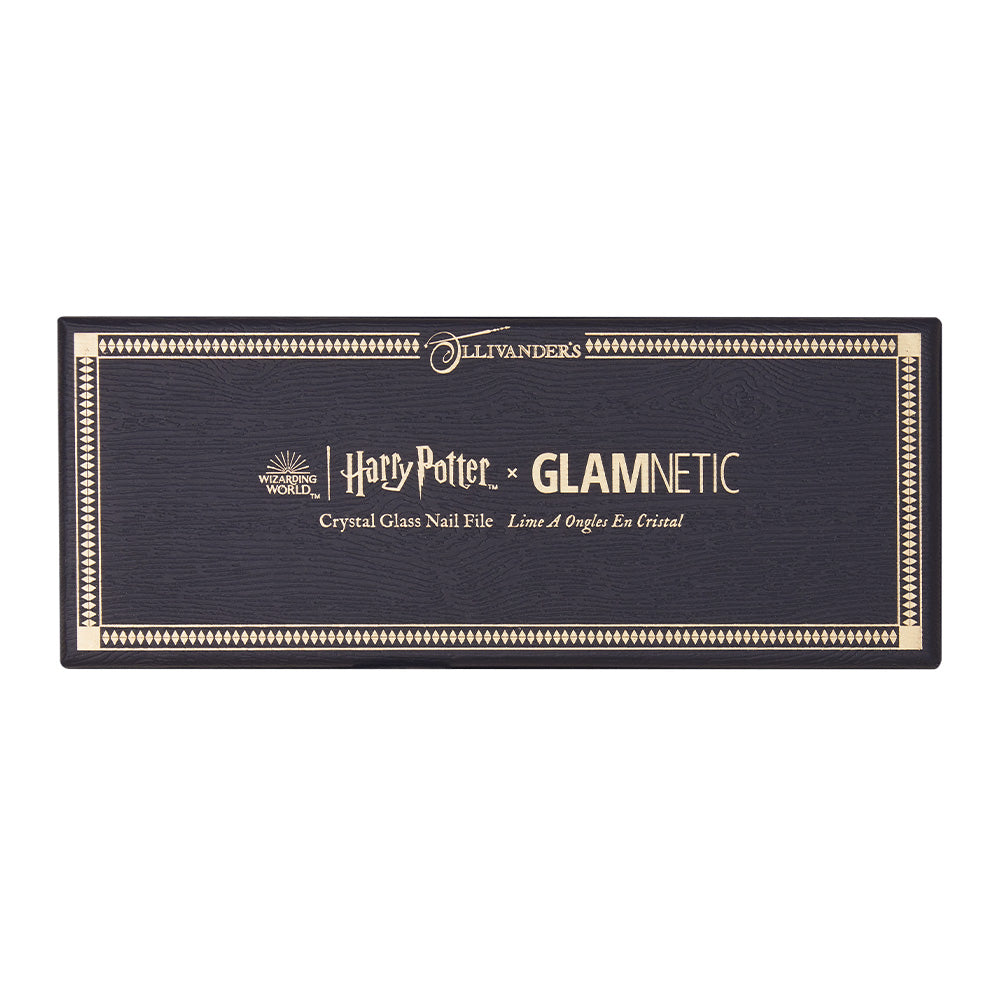 A rectangular black box with gold accents features the glamnetic logo and is labeled Harry Potter™ Crystal Glass Nail File in English and French. - Product image