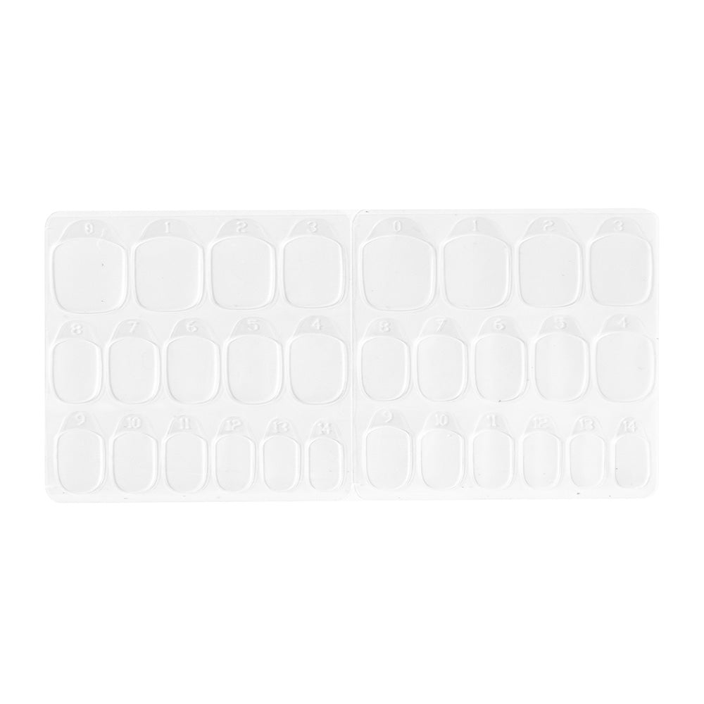 Two clear trays from glamnetics Harry Potter™ Adhesive Nail Tabs hold multiple press-on nails in various sizes, neatly arranged in rows with each compartment numbered. The trays are placed side by side for easy selection.