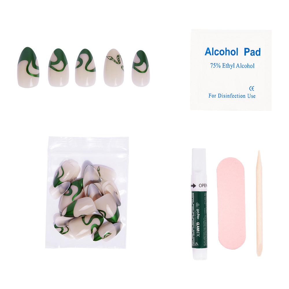 The Parseltongue™ Nail Set by glamnetic features short almond nails in green and cream with a chrome emerald swirl, plus an alcohol pad, adhesive, pink nail file, cuticle stick, extra nails—all on a white background. - Product image