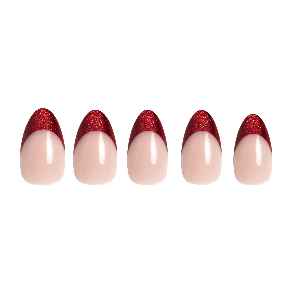 The glamnetic Red Affair set includes five short almond artificial nails with a nude base and glitter French tips, arranged in a row on a white background for an elegant, glamorous look. - Product image