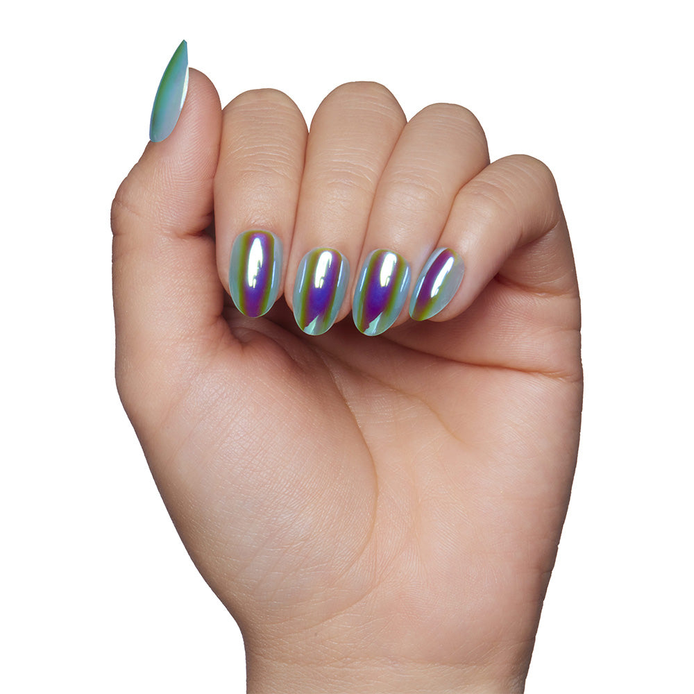 A hand with short, almond-shaped nails from glamnetics Siren set displays a shiny, holographic green and purple finish against a white background. - Product image
