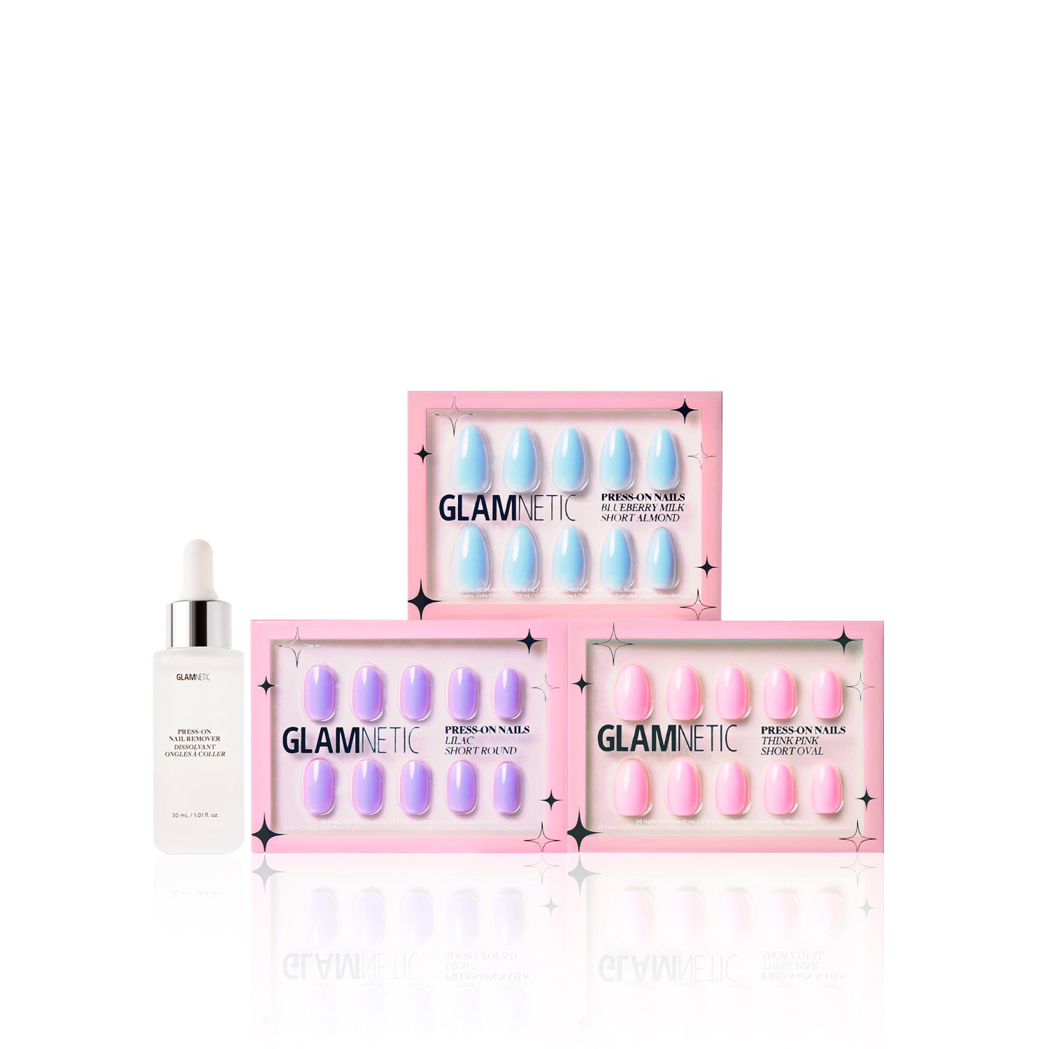 Three boxes of glamnetic Blooming Buds press-on nails are stacked beside a white dropper bottle labeled glamnetic Cuticle Oil, all set against a white background. - Product image