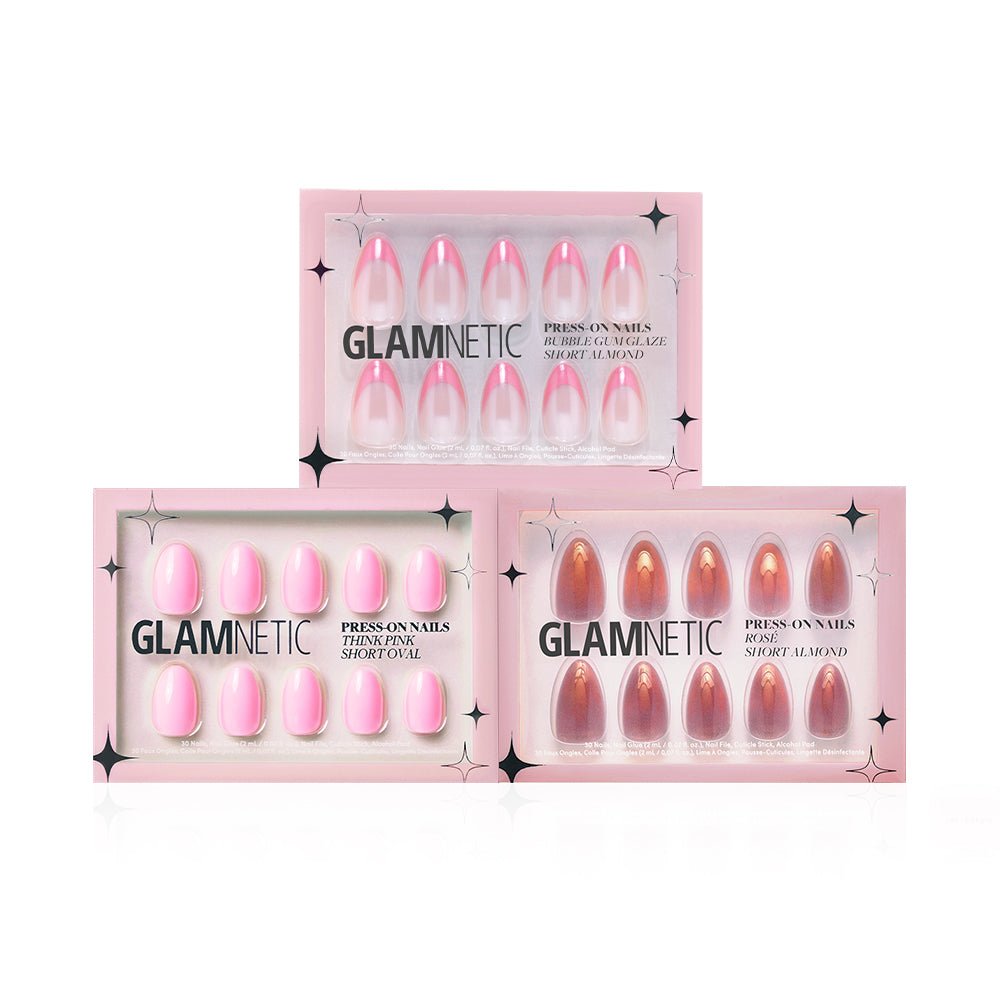 Three boxes of glamnetic press-on nails are displayed, featuring different styles such as Blush Crush in pink and brown shades, with Short Oval and Short Almond shapes, all in signature pink packaging. - Product image