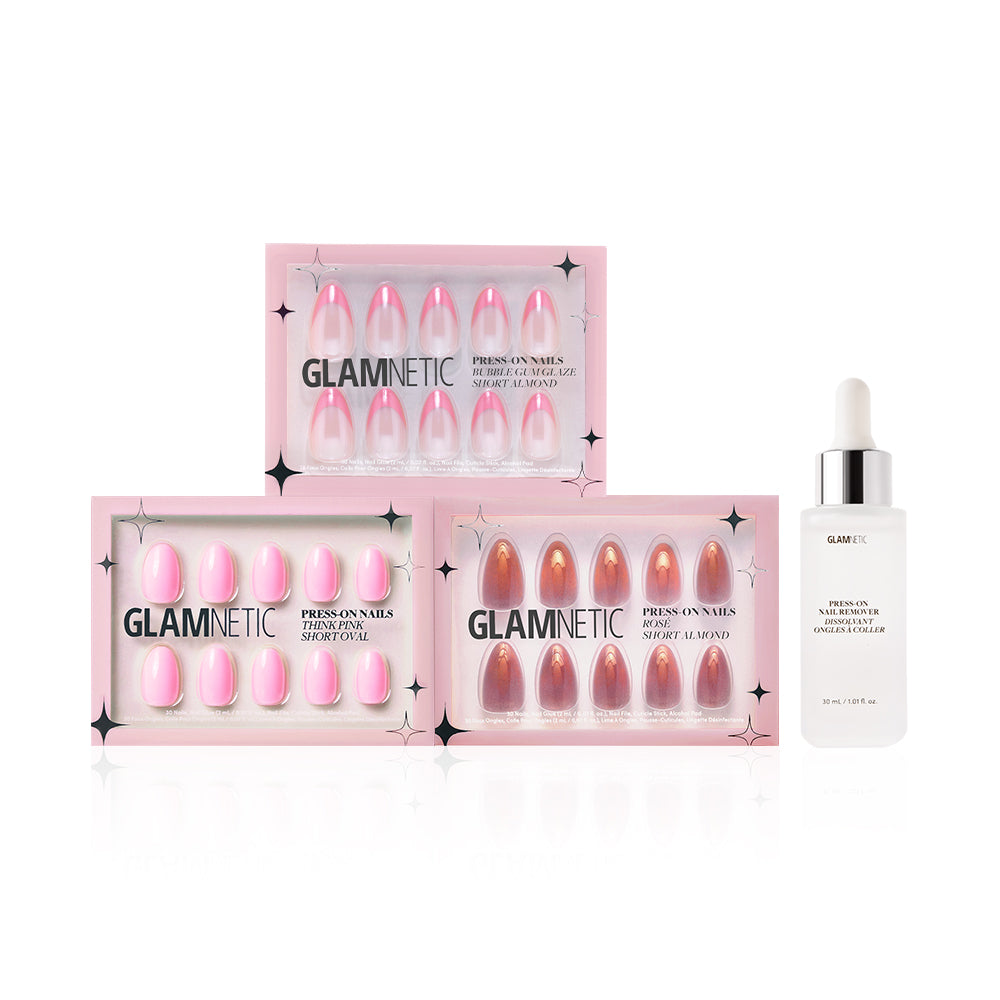 Three boxes of glamnetic Blush Crush press-on nails in pink shades, including Bubble Gum Glaze, are shown beside a bottle of glamnetic nail glue with a dropper cap on a white background. - Product image