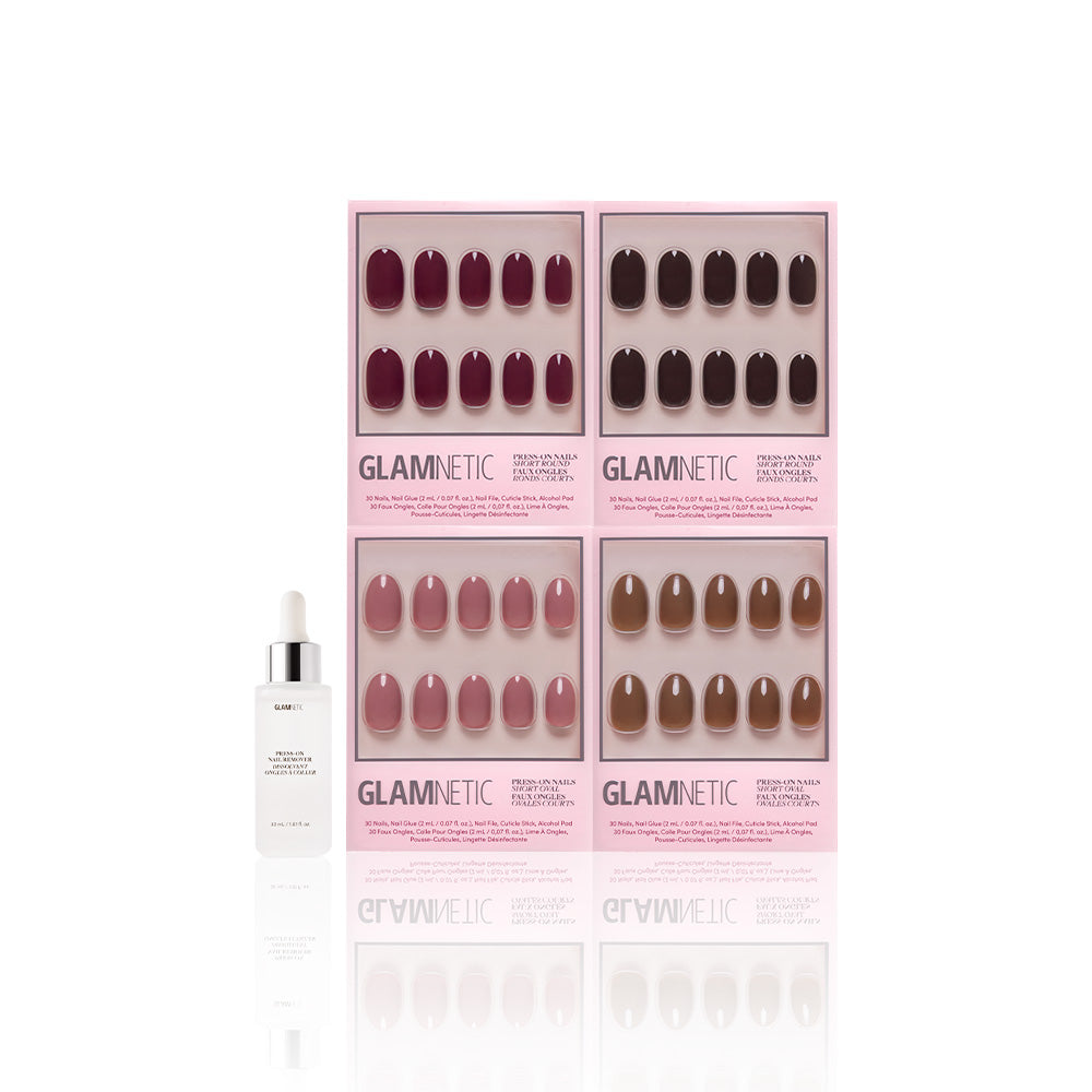 A bottle with a dropper sits beside four pink boxes of glamnetic Fauna & Flora Vegan & Cruelty-free press-on nails, featuring Short Oval and Short Round sets in deep burgundy to light nude shades, all on a white background. - Product image