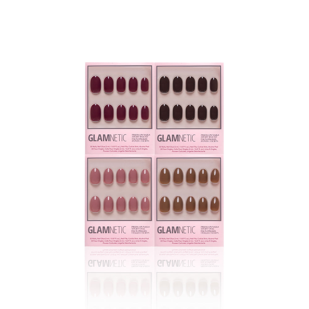 Four sets of glamnetic Fauna & Flora vegan, cruelty-free press-on nails in pink, purple, and brown shades are displayed in pink packaging on a white background. - Product image
