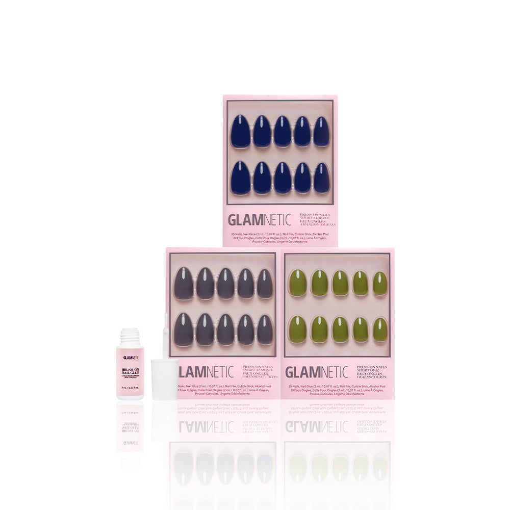Three boxes of glamnetic Nature Lover press-on nails are stacked, with a small bottle of nail glue to the left, all displayed on a white background. - Product image