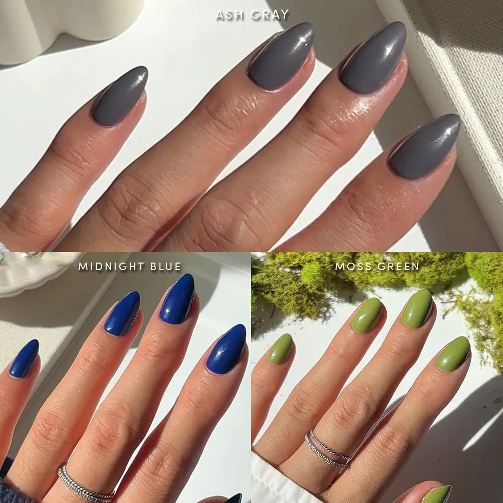 Three hands with manicured short almond nails in distinct colors—ash gray, midnight blue, and moss green—each displayed separately under natural light to highlight the vegan Nature Lover nails by glamnetic. - Product image