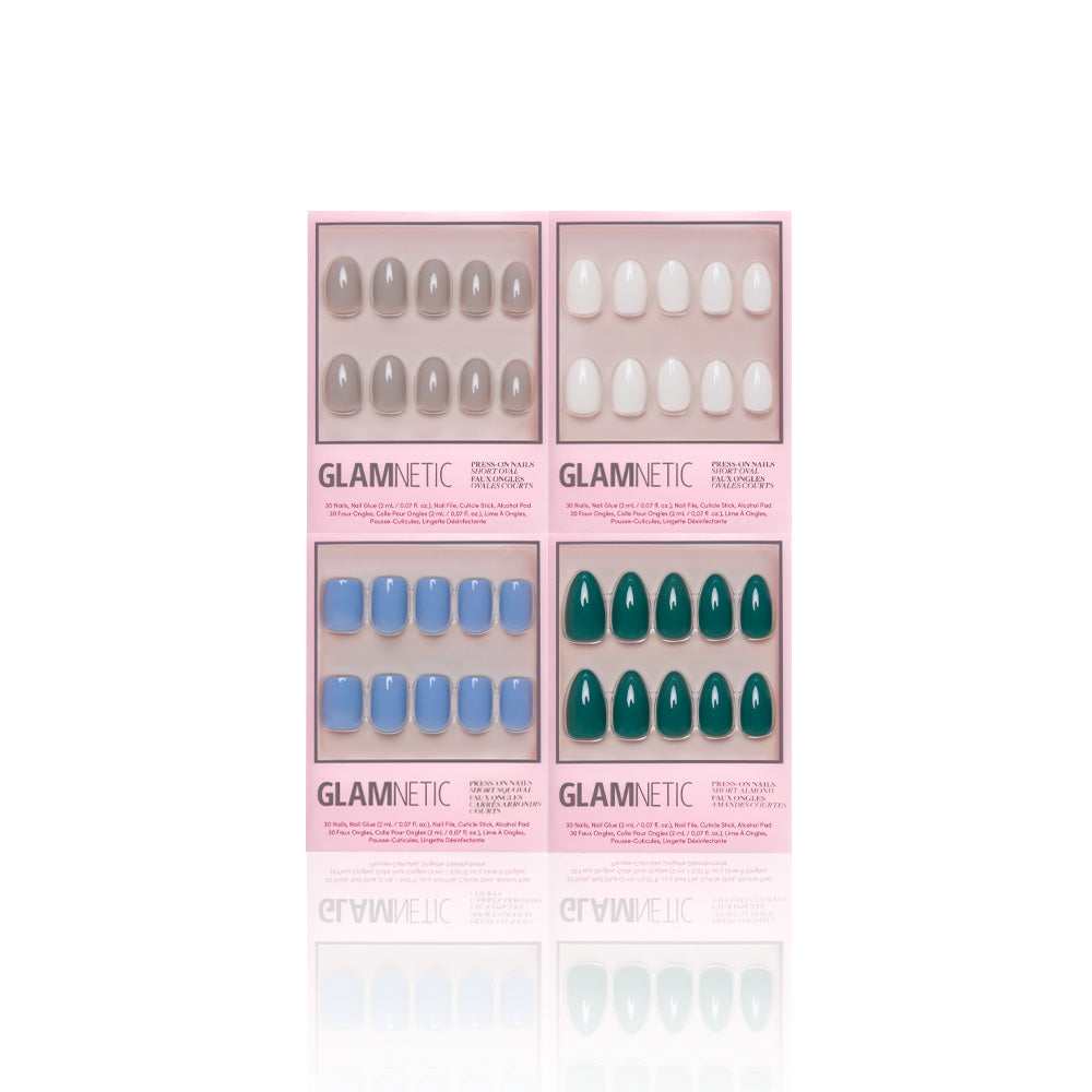 Four boxes of glamnetic Frosted Fantasy press-on nails in pink packaging—taupe, white, blue, and jewel-toned green—are vegan, cruelty-free sets arranged in a grid on a white background. - Product image
