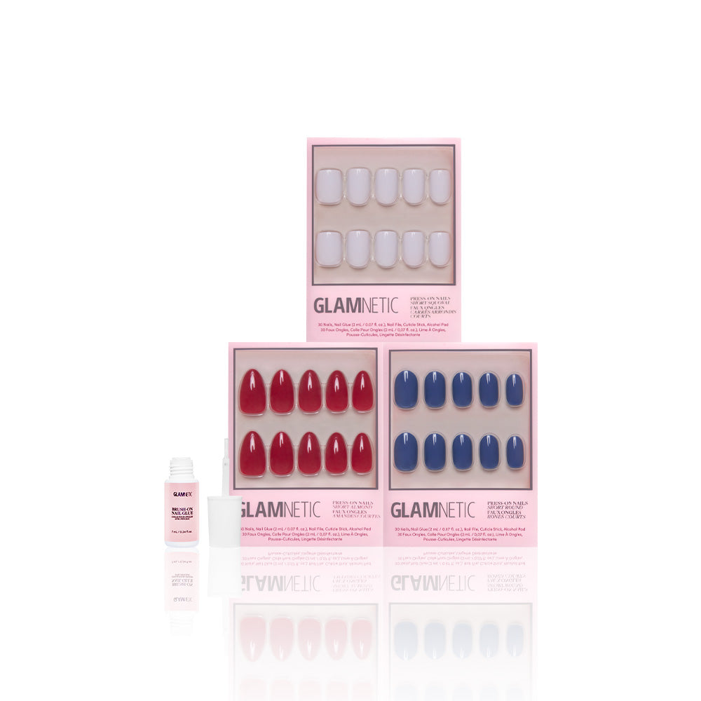 Three boxes of glamnetic Royal Decadence press-on nails are stacked together, with a small bottle of nail glue placed beside them on a white background. - Product image
