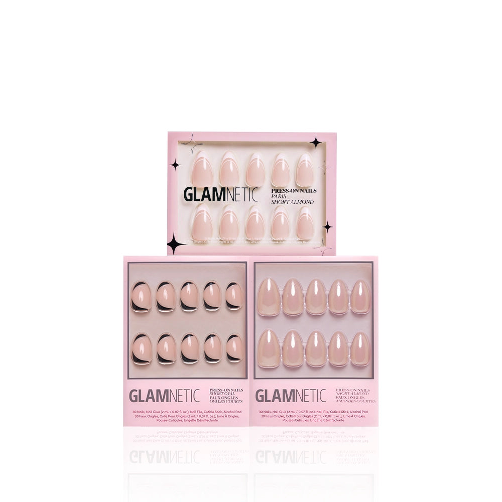Three sets of glamnetic’s Glam and the City salon-quality press-ons in pink boxes, each featuring a unique nude nail design, arranged on a white background—perfect for achieving elegant manicures at home. - Product image