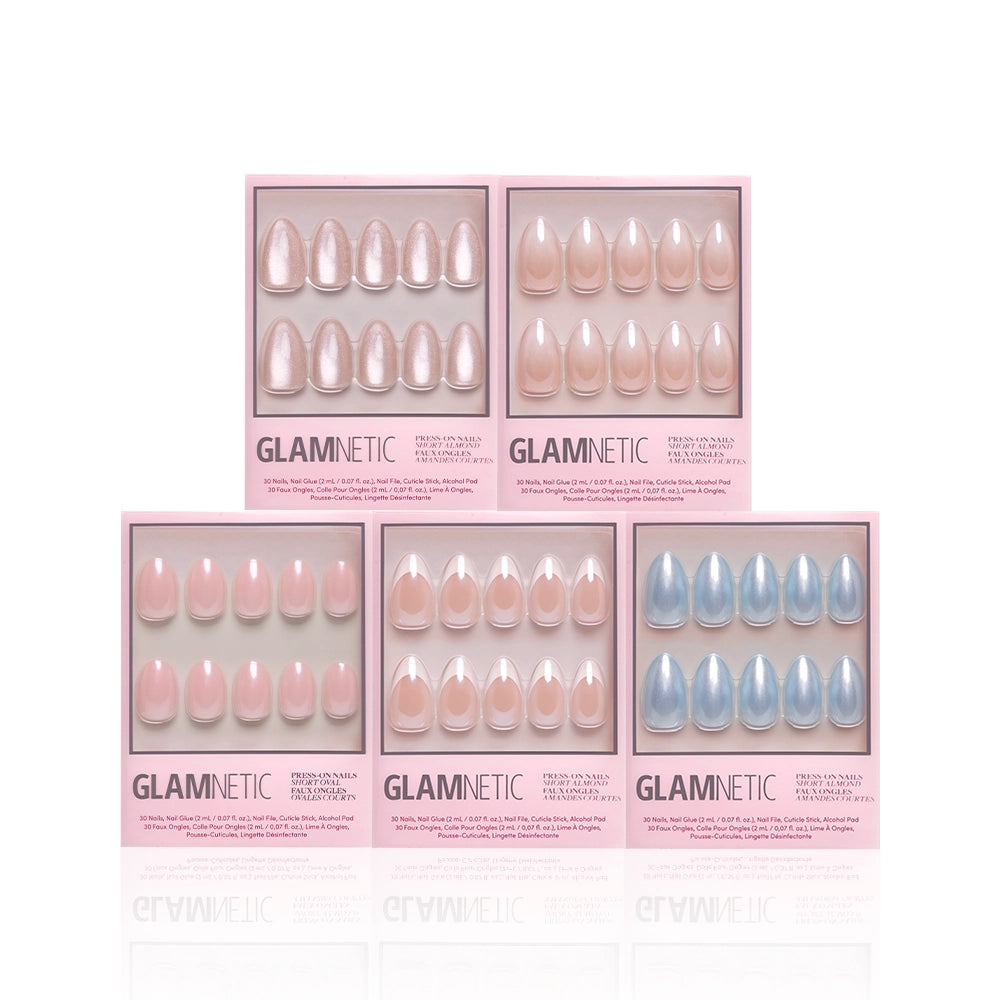 Five boxes of glamnetic Forever and Always press-on nails are displayed in two rows: four sets in nude or light pink, ideal for engagement looks, and one in light blue. Each box highlights chic, modern designs with neatly arranged artificial nails. - Product image