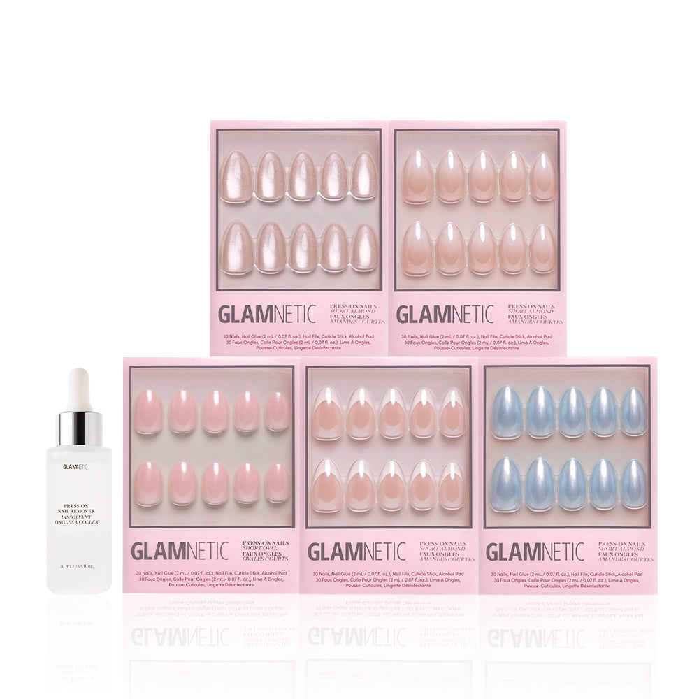 Five boxes of glamnetic Forever and Always press-on nails in nude and pastel designs are arranged in two rows, with a bottle of glamnetic nail glue and a dropper placed at the front left. - Product image