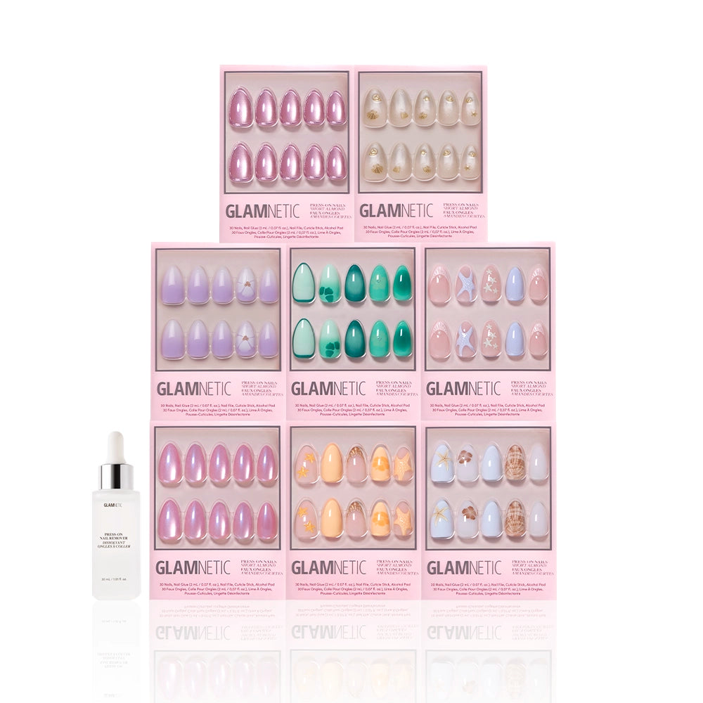 Eight boxes of Glamnetic Almonds At Sea press-ons in pastel colors and 3D starfish accents are stacked together, with a small white dropper bottle on the left, all set against a white background. - Product image