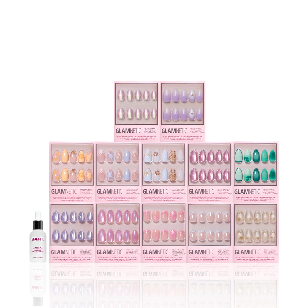 Siren's Cove Collection - Ten boxes of glamnetic’s Siren’s Cove Collection press-on nails, featuring ocean-inspired 3D nail art, are stacked in a pyramid shape. A small white bottle of nail glue sits to the left, all set against a white background.