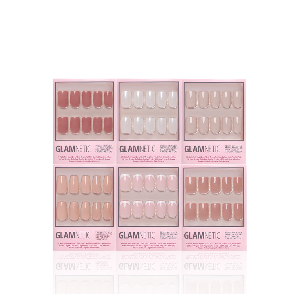 Six boxes of glamnetic’s The Sculpted Set press-on nails in nude and pink shades are arranged in two rows of three on a white background. Each box features glossy nude nails visible through a clear window. - Product image