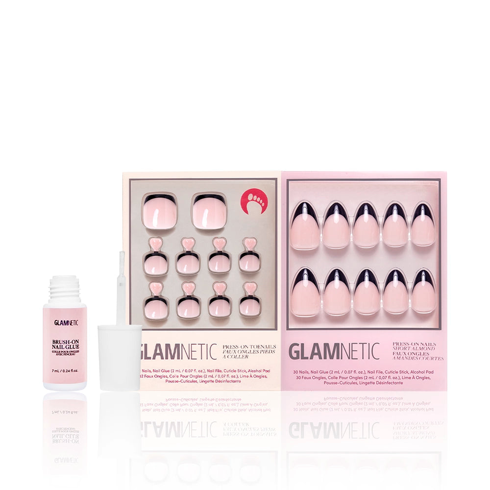 Caviar Mani & Pedi bundle by Glamnetic displayed with pink brush-on nail glue. The press-on toenail and fingernail sets both feature glossy black French tips on a blush-toned base. - Product image