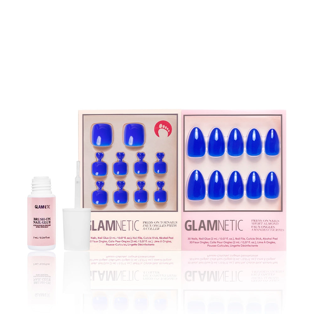 Glamnetic Cobalt Blue Mani & Pedi set shown with pink brush-on nail glue. The press-on nails feature a high-gloss, bold blue color in matching pedicure and manicure styles. - Product image