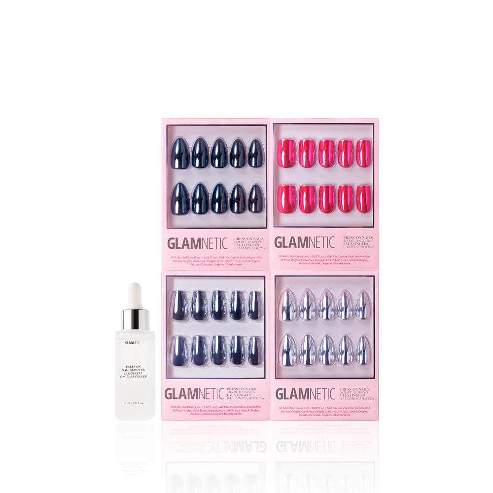 Four sets of Glamnetic Neon Noir press-on nails with metallic chrome finish in pink boxes and a bottle of Glamnetic cuticle oil with dropper, all displayed on a white background. - Product image
