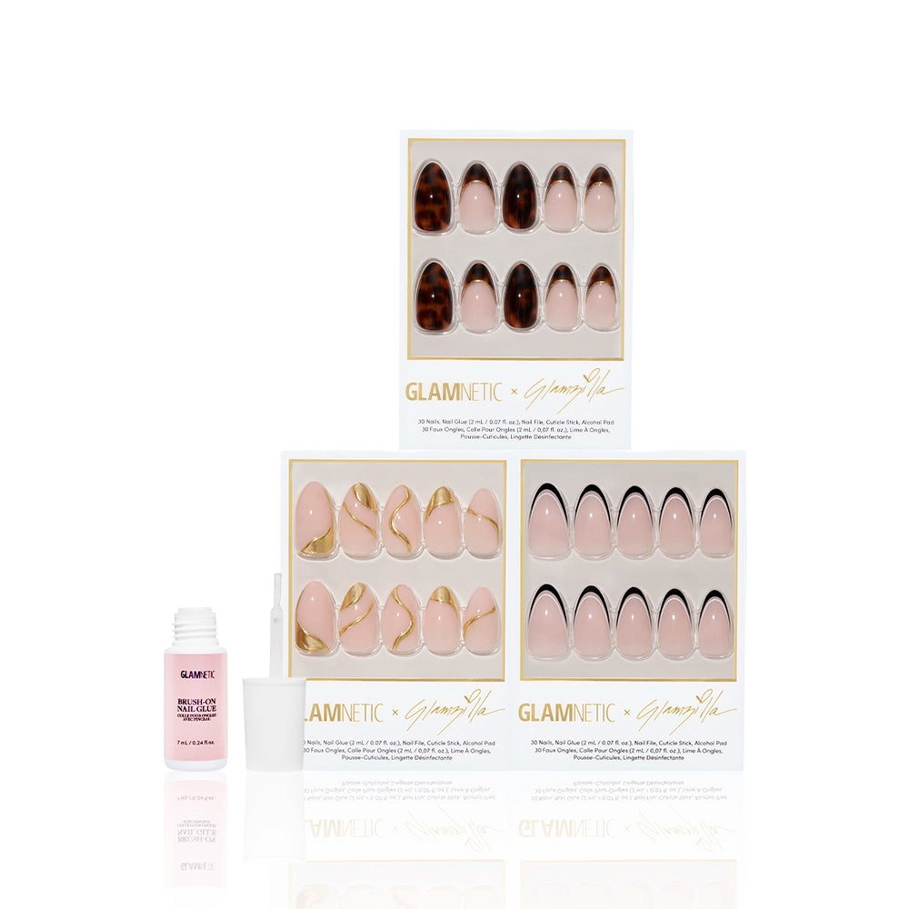 Flat lay of Glamnetic x Glamzilla ‘Oui Did That’ press-on nail collection bundle with included Glamnetic brush-on nail glue in pink packaging. Nail designs shown: Killazilla, No In Between, and I Am A Rich Man? - Product image