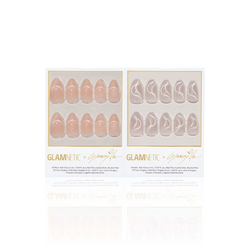 Product display of Glamnetic x Glamzilla ‘Velvetzilla’ press-on nail collection featuring two designs: ‘Not Your Cinder-Ella’ in soft glittery peach nude, and ‘Woo-Man!’ with a silvery velvet swirl design. Packaged in signature gold-trimmed boxes. - Product image