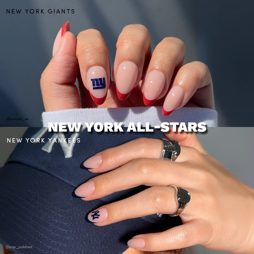 Two manicured hands wear glamnetic’s New York All-Stars Giants & Yankees press-on nails—one with red-tipped Giants and logo, the other in navy Yankees. NEW YORK ALL-STARS displays, plus a Yankees cap in the second image. - Product image