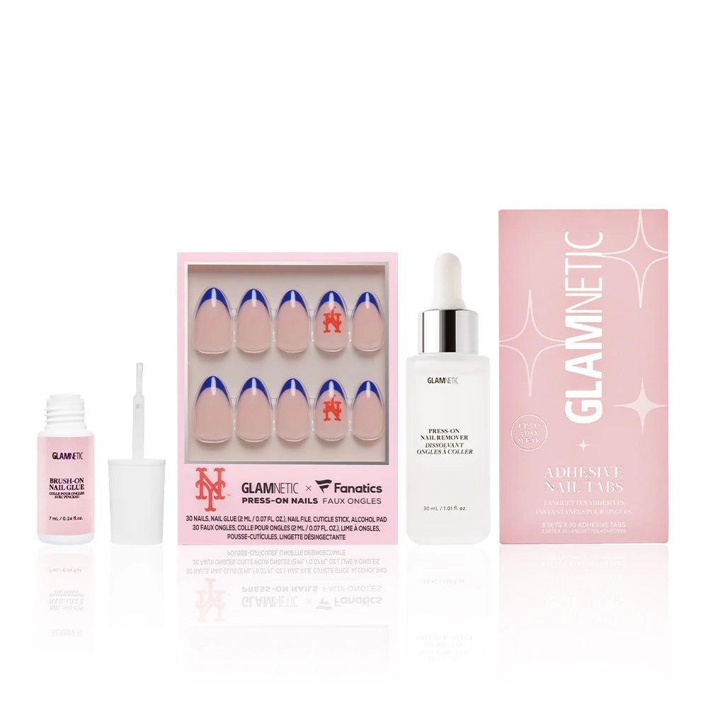 The New York Mets Major League Mani by glamnetic is a press-on nail set with blue tips and Mets designs, including adhesive tabs, nail glue, and remover, all in chic pink and white packaging. - Product image