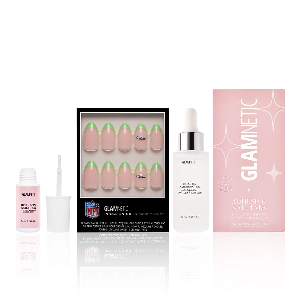The glamnetic Seattle Seahawks Press-On Playbook features pink and green French tip press-on nails, adhesive nail glue, press-on nail remover, and adhesive nail tabs—all displayed on a white background. - Product image