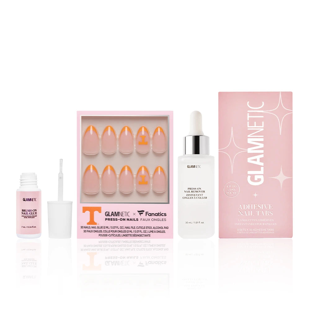 The Tennessee Volunteers Gameplan press-on nails set by glamnetic, featuring pink tips, comes with adhesive nail tabs, press-on nail polish glue, and packaging—all shown on a white background.