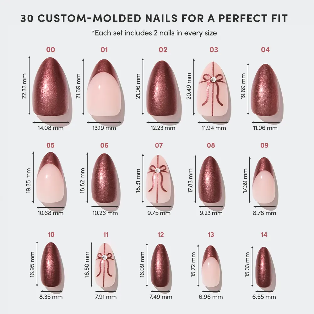 The "She's A Gift" set by glamnetic features 15 sizes of custom-molded, pink and burgundy chrome short almond nails—with some decorated with bows and rhinestones. Each set includes 2 nails per size (30 nails total) and size measurements in millimeters. - Product image