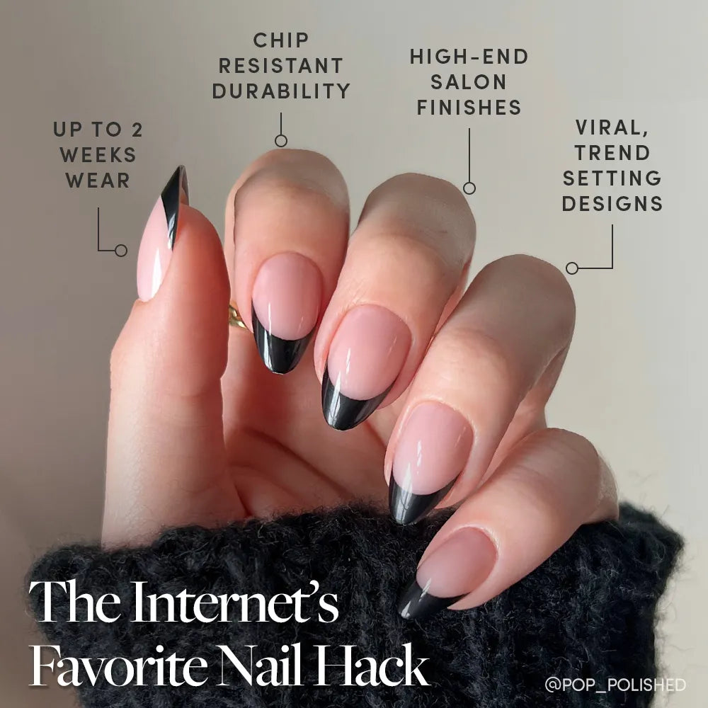 A hand with long, almond-shaped nails in the trendy black French tip "Caviar" design by glamnetic is shown, highlighting chip-resistant durability, salon-quality finish, up to 2 weeks wear, and viral Caviar Press-On Nails style. - Product image