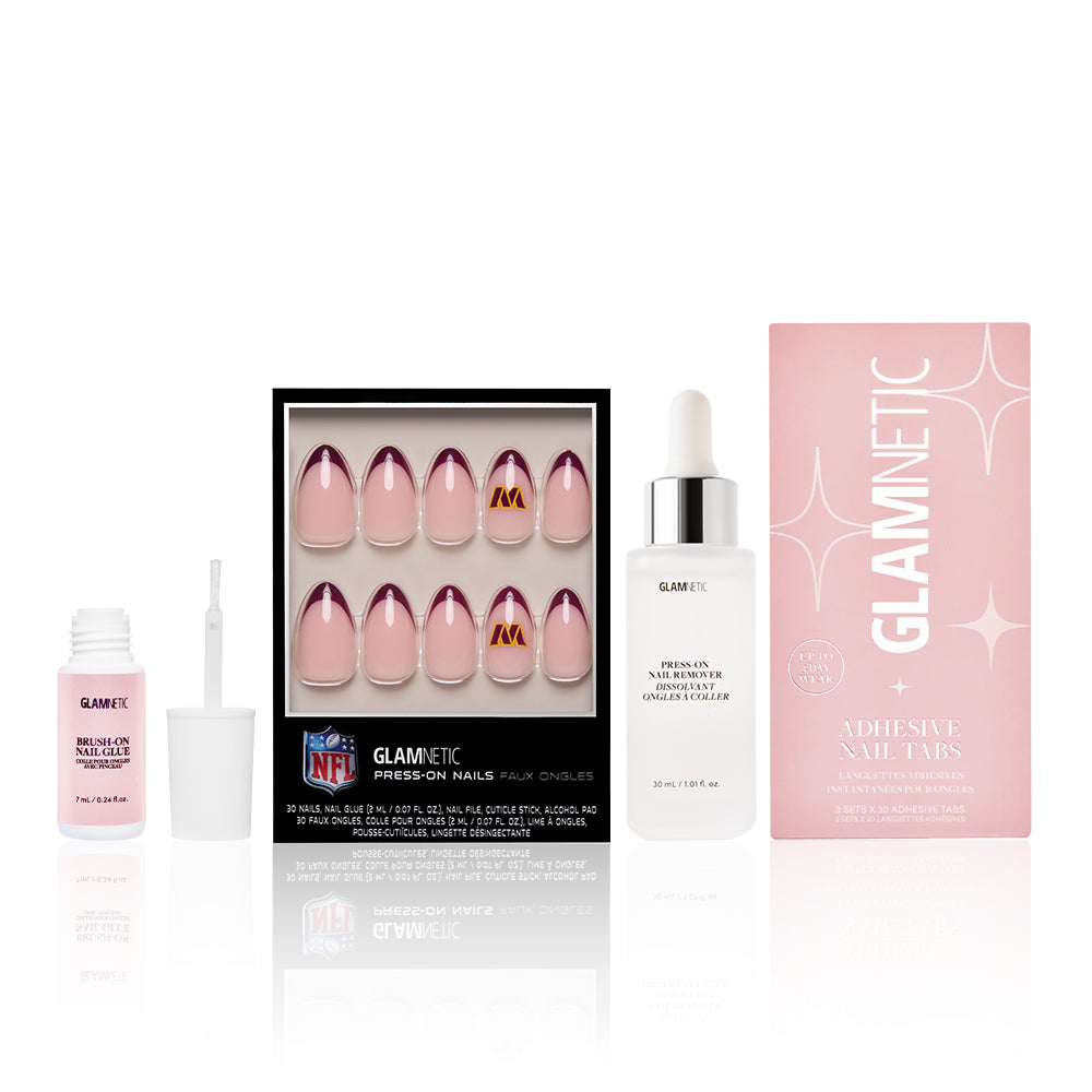 The Washington Commanders Press-On Playbook by glamnetic includes salon-quality press-on nails, pink nail glue with brush, cuticle oil in a clear dropper bottle, and adhesive nail tabs, all displayed against a white background. - Product image