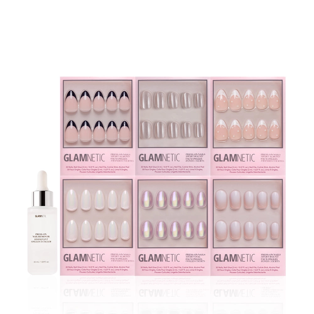 Six boxes of glamnetic Pearly Pick-Me-Ups press-on nails in nude and iridescent styles, some with pearl accents, are arranged in two rows with a glamnetic cuticle oil dropper bottle displayed in front. - Product image