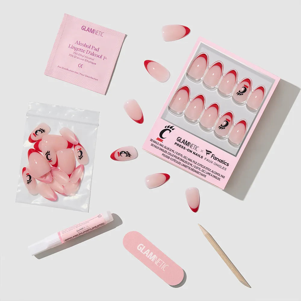 The glamnetic Cincinnati Bearcats Press-On Nail Set features salon-quality pink nails with red French tips and eyelash designs, and comes with an alcohol pad, nail file, cuticle stick, adhesive, and extra nails. - Product image