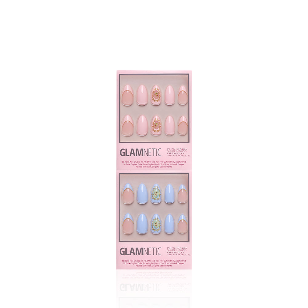 Two boxes of glamnetic's Heaven Sent press-on nails, featuring almond pastel pink and blue sets with 3D gold details and gem accents, are displayed against a white background. - Product image